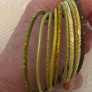 Set of 10 assorted yellow and gold  colored bangles from India